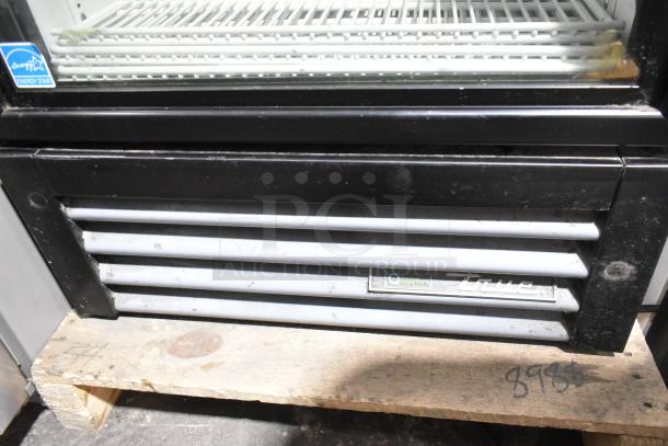 2023 True GDM-12-HC single door merchandiser, metal, Energy Star rated, poly coated racks, visible True logo, used condition.