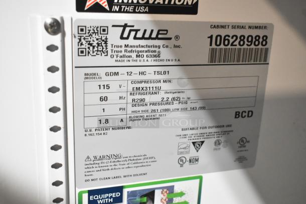 True GDM-12-HC commercial cooler label detailing 115V, 60Hz, refrigerant R290, and model information, suitable for outdoor use.