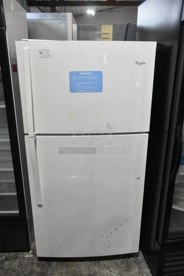 Whirlpool WRT511SZDW00 refrigerator with top freezer, 115V, 1 Phase. Moderate wear, visible marks, and labels indicating auction details.