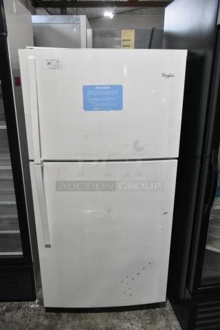 Whirlpool WRT511SZDW00 refrigerator with top freezer, 115V, 1 Phase. Moderate wear, visible marks, and labels indicating auction details.