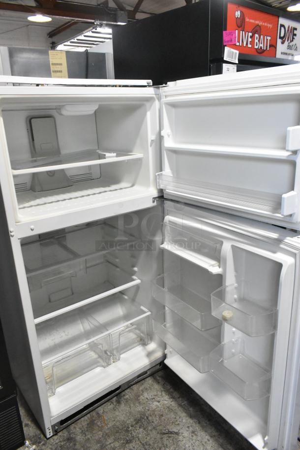 Whirlpool WRT511SZDW00 cooler with freezer, 115 volts, 1 phase. Features multiple shelves, door bins; appears in good condition.