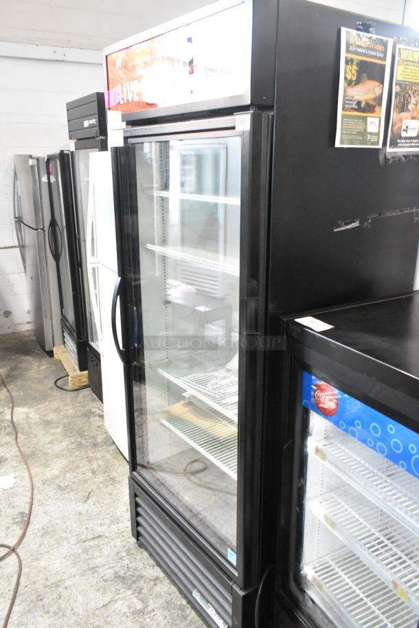 2023 True GDM-26-HC Single Door Reach-In Cooler, glass door, poly-coated racks, commercial grade, 115V, excellent condition.