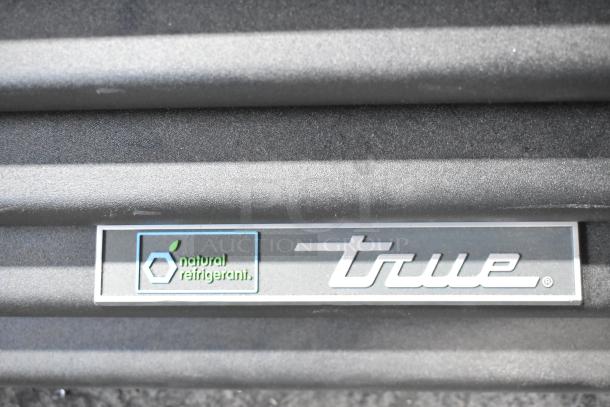 True GDM-26-HC cooler label with "natural refrigerant" marking, indicating eco-friendly design.