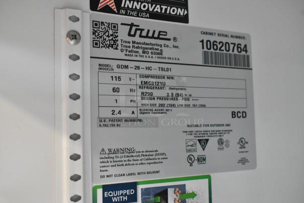 Label of 2023 True GDM-26-HC Commercial Cooler, 115V, 1 Phase, R290 Refrigerant, serial number 10620764, with safety warning.