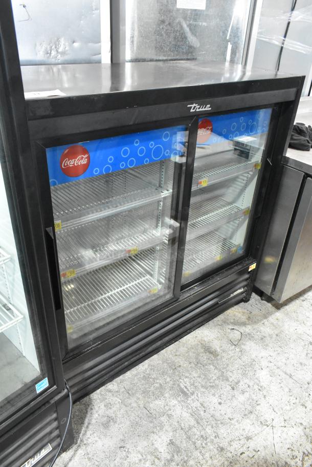 2019 True GDM-41SL-48-HC-LD 2-door cooler merchandiser with poly racks, 115 volts, single phase, Coca-Cola branding.
