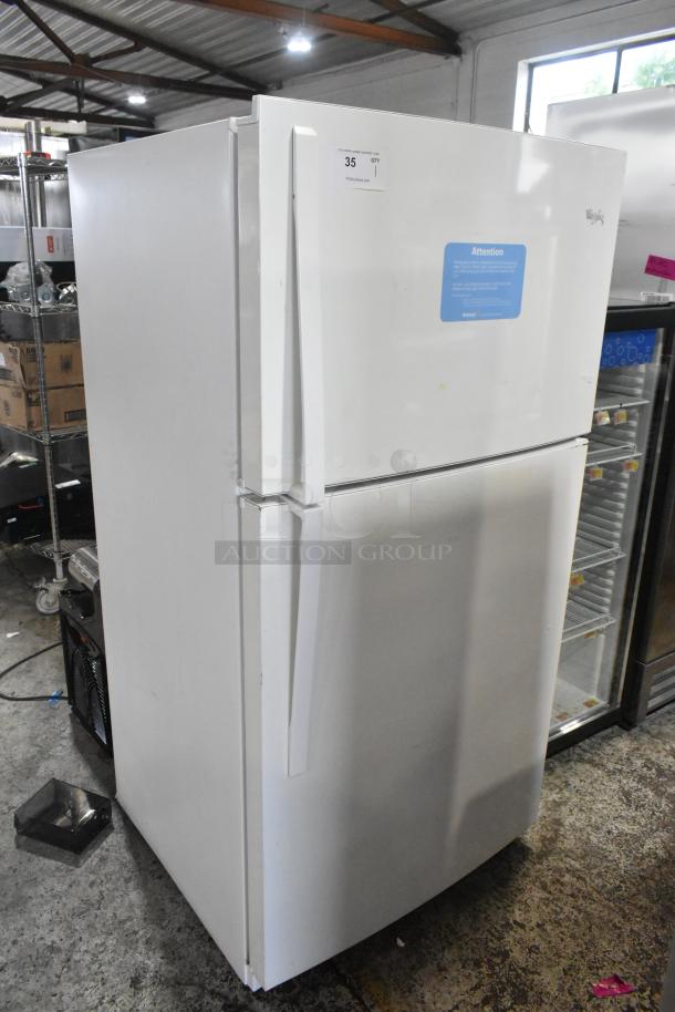 Whirlpool WRT511SZDW00 white fridge with freezer, 115V, 1 phase. Visible label and minor wear. Auction item.