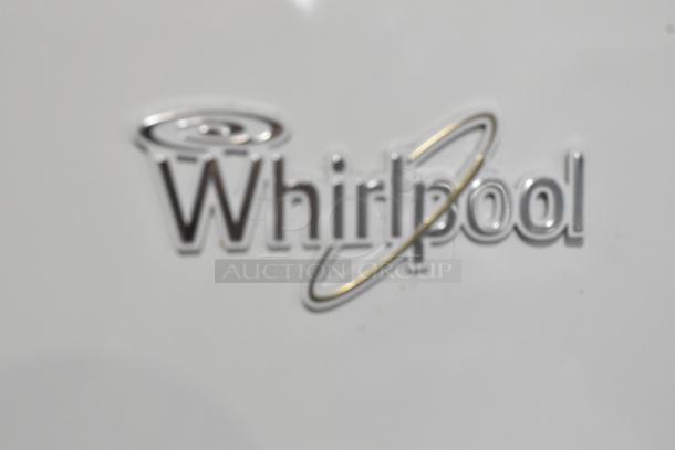 Whirlpool WRT511SZDW00 refrigerator with freezer. 115 volts, 1 phase. Features Whirlpool logo. Excellent condition.