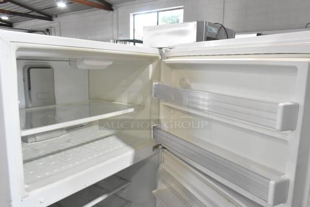 Whirlpool WRT511SZDW00 cooler with freezer, 115V, 1 Phase. Spacious interior, door storage shelves, good condition.