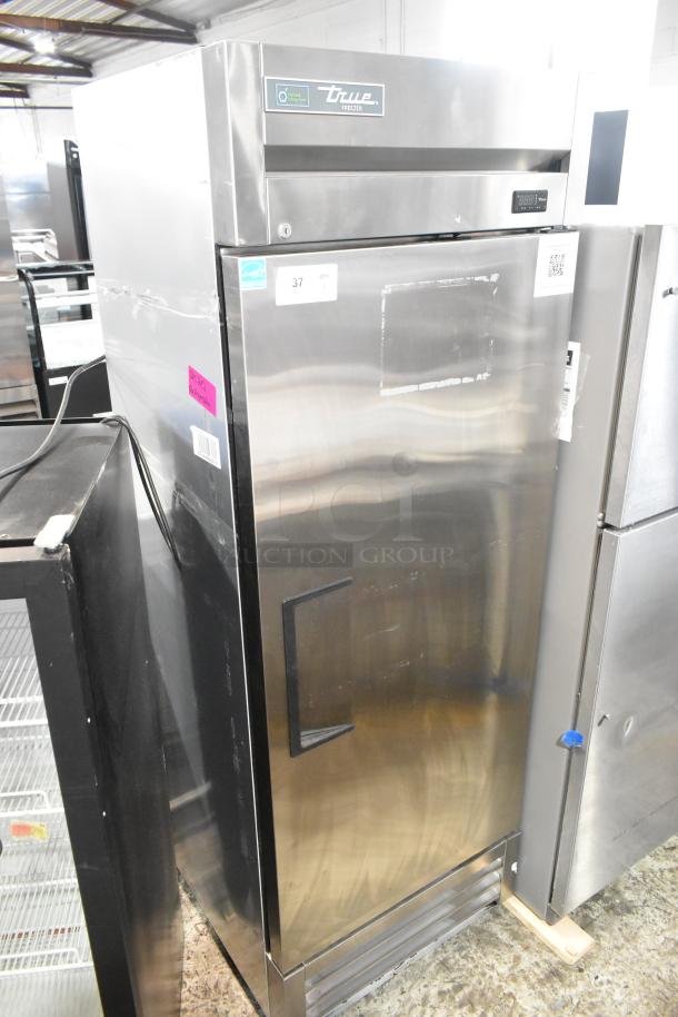 2022 True T-19F-HC stainless steel single door reach-in freezer with poly coated racks, 115V, good condition.