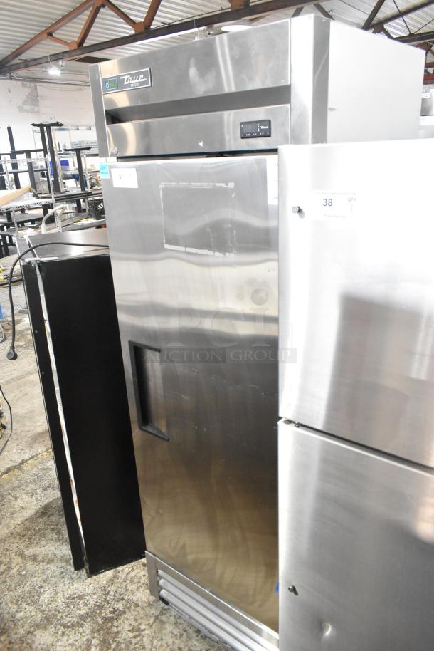 2022 True T-19F-HC stainless steel commercial single door reach-in freezer with poly-coated racks, digital display.