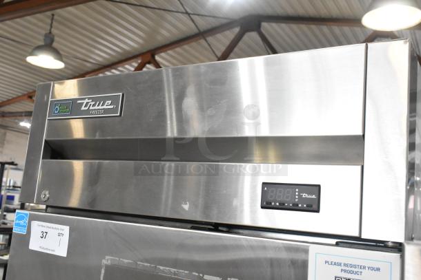 2022 True T-19F-HC stainless steel commercial single door reach-in freezer with poly-coated racks, digital display, 115V.