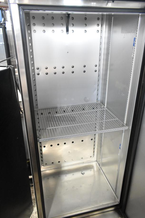 2022 True T-19F-HC Stainless Steel Commercial Freezer with poly coated racks. 115V, 1-phase. Clean interior.