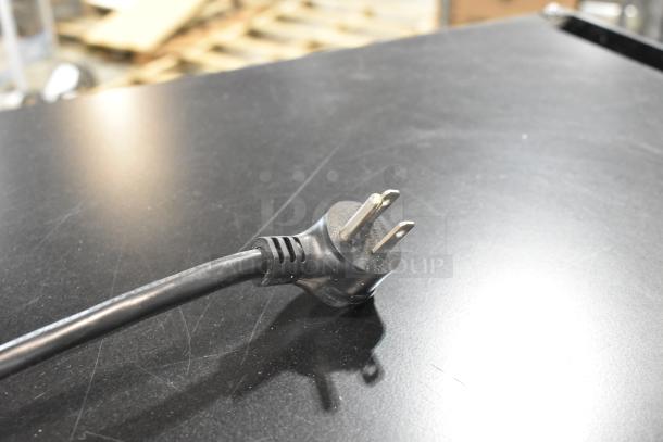 2022 True T-19F-HC freezer plug on black surface, suitable for 115 Volts, 1 Phase. Clean, commercial-grade.