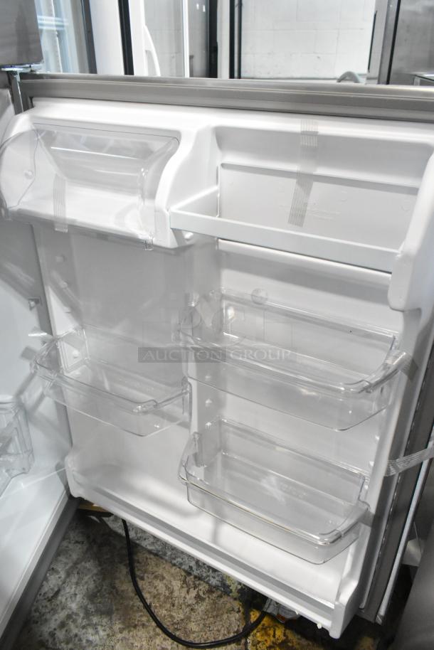 2025 Whirlpool 21MSTFATR6 stainless steel cooler with freezer, interior view. Features clear shelves, 115 volts, 1 phase.