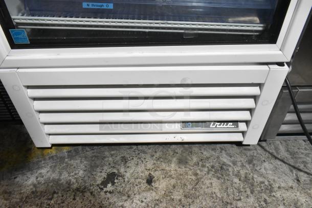 2021 True TSCI-600R-G-PH metal single door reach-in cooler, poly coated racks, Energy Star, 115V, 1 phase.