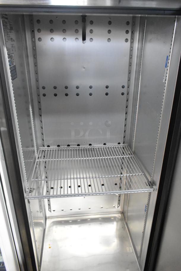 2022 True T-19F-HC stainless steel single door freezer, poly coated racks, excellent condition. 115V, 1 Phase.
