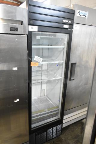 2019 Habco SE18 metal single door reach-in cooler with glass front, poly-coated racks, tags visible, excellent condition.