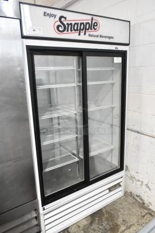 Beverage Air MT38 2-door cooler, metal frame, poly-coated racks, good condition, Snapple branding, 115V, 1-phase.