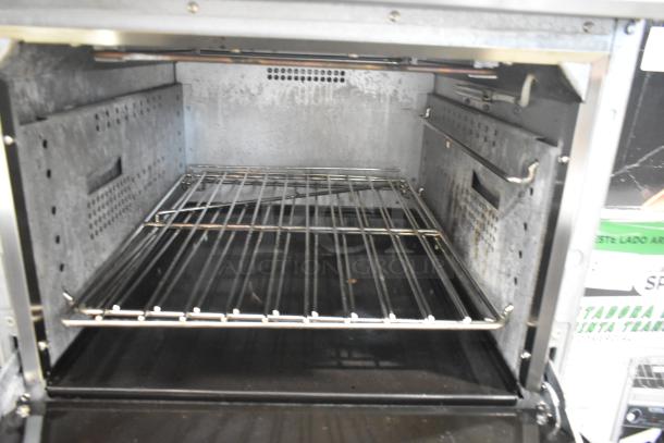 Cookline ER24-208 stainless steel commercial oven interior, featuring adjustable metal racks and durable construction.