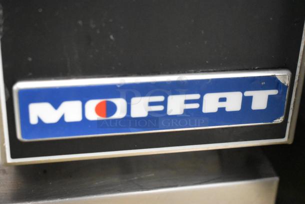 Moffat Turbofan convection oven logo on stainless steel body, featuring view-through door and metal racks for commercial use.