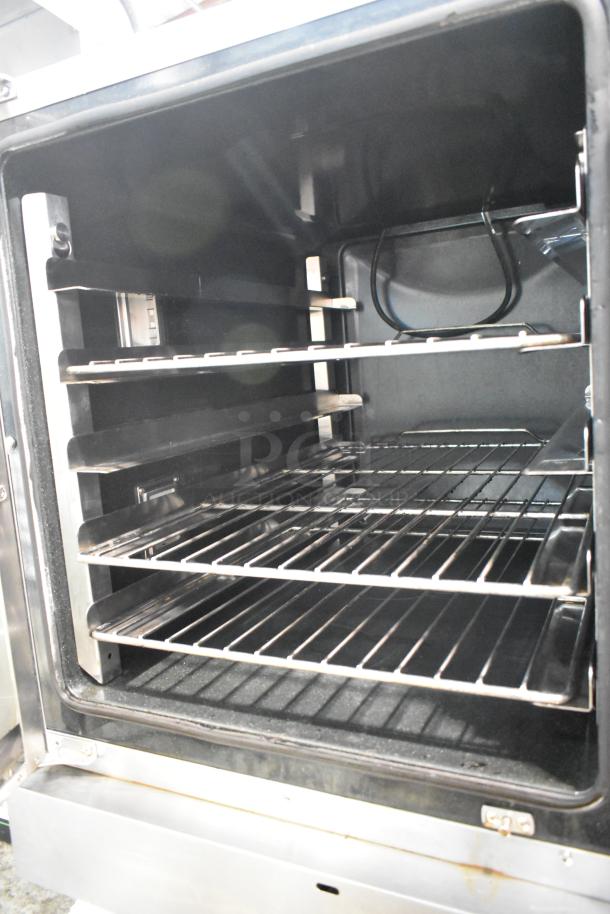 Moffat Turbofan stainless steel electric convection oven with view-through door, metal racks, in excellent condition.