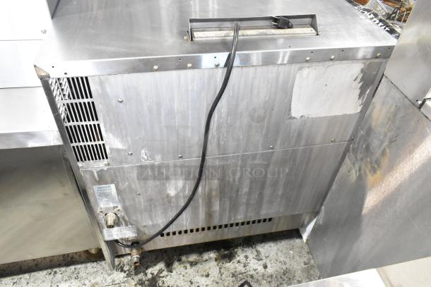 Moffat Turbofan stainless steel convection oven, electric-powered, view-through door, metal racks, exterior condition visible.