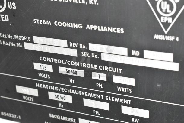 Label on Vulcan VSX24E steam cabinet, showing model, voltage (208V), phase (3), and serial number details for commercial use.