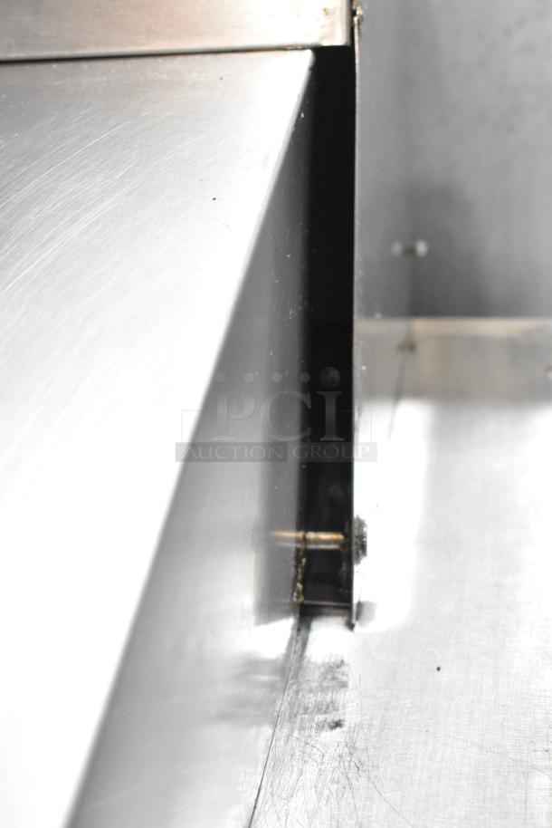 Maxx Cold MXCR48MHC stainless steel sandwich prep table detail, showing a smooth, reflective surface with visible screws.