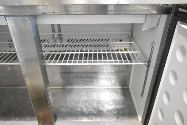 Maxx Cold MXCR48MHC prep table interior, stainless steel, wire shelving, commercial casters visible, good condition.