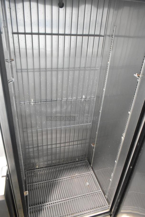 True T-19F stainless steel commercial freezer, single door, interior view, wire shelves, 115V, 1 Phase, good condition.