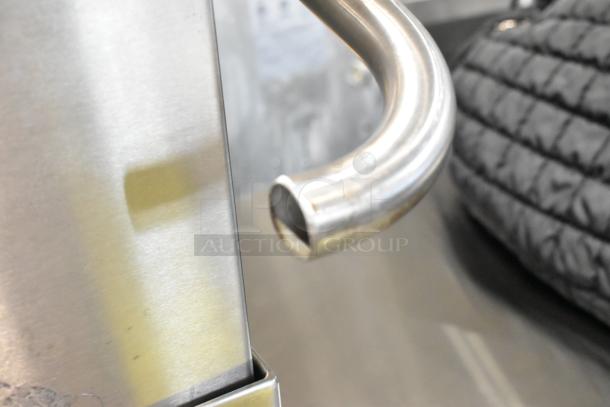 Alt text: Close-up of 2016 Fagor COP-174W Stainless Steel Commercial Dishwasher handle, showing polished metal finish.