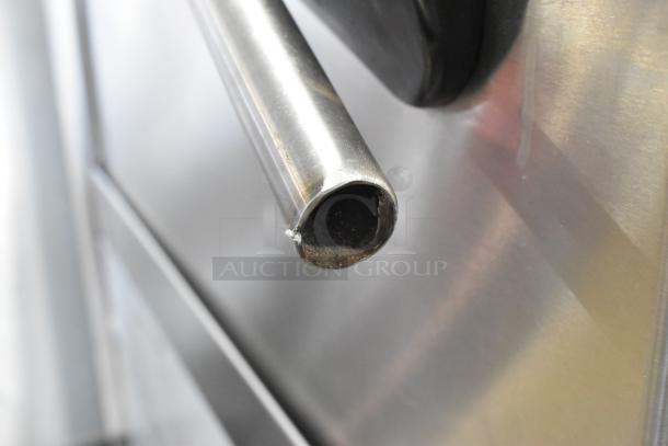 2016 Fagor COP-174W stainless steel handle detail on straight pass-through dishwasher, slight wear visible.