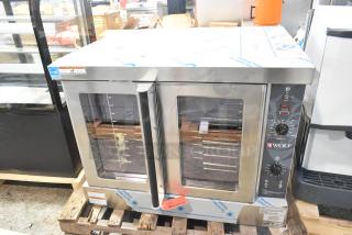Brand new Wolf WC4GD-21D3 stainless steel convection oven with view-through doors, metal racks, and thermostatic controls.