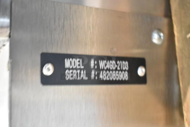 Model and serial number tag for the Wolf WC4GD-21D3 commercial convection oven, featuring stainless steel construction.