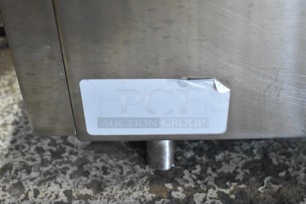 Proluxe stainless steel commercial countertop panini press, 208 volts, 1 phase, with visible wear and blank label.