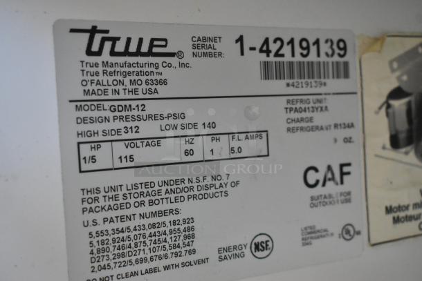 True GDM-12 single door cooler label, 115 volts, 1 phase, metal construction, poly-coated racks, NSF certified.