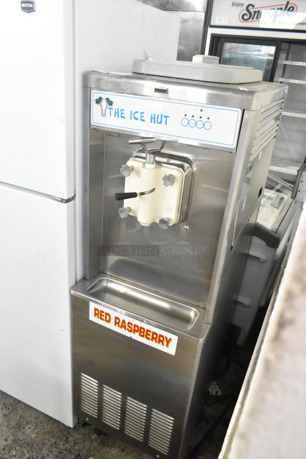 Taylor 441-33 stainless steel soft serve ice cream machine, single flavor, water-cooled, on casters, "The Ice Hut" label.
