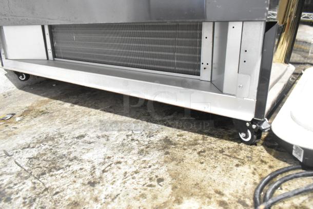 Avantco 193CAC48B black metal refrigerated air curtain merchandiser with casters, 47 3/16" wide.