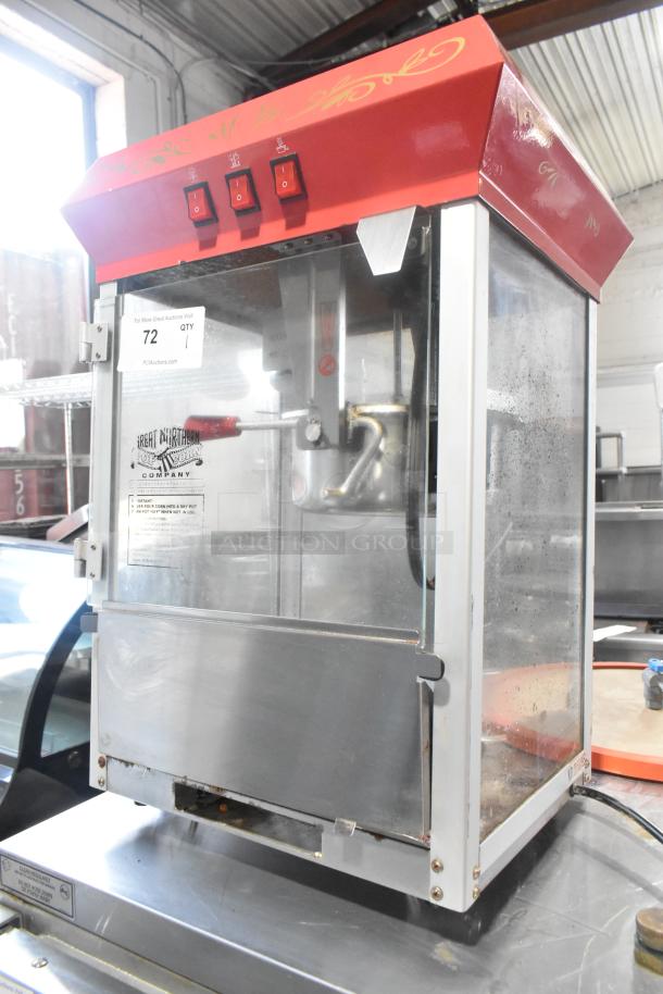 Great Northern 6128 metal countertop popcorn machine, red top, three switches, glass panels, visible use marks, 120V, 1 phase.