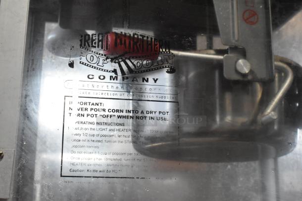 Great Northern 6128 metal popcorn machine. Features visible logo and operating instructions. For commercial use, 120V, 1 phase.