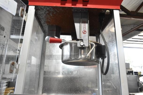 Great Northern 6128 popcorn machine, metal, countertop model, 120 volts, commercial use, visible handling labels, good condition.