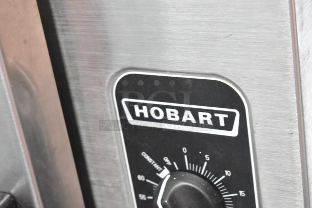 Hobart HC24EA3 stainless steel steam cabinet control panel with brand logo, visible dials, and settings.
