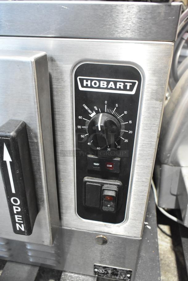 Hobart HC24EA3 stainless steel steam cabinet control panel with dial and switches, marked for ready and cook modes.