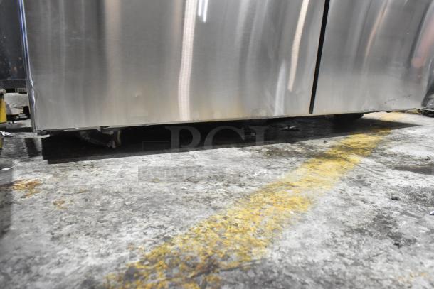 2024 Avantco 178APT60MHC stainless steel prep table with commercial casters, visible scuff marks; ideal for kitchen use.