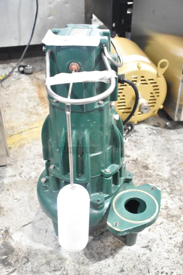 Zoeller M2B2-D Metal Pump, 115V, 1 Phase, green, with attached float; suitable for heavy-duty applications.