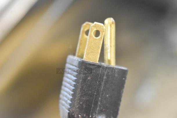 Close-up of a Zoeller M2B2-D pump plug showing two-prong, 115V, 1 phase connector in good condition.