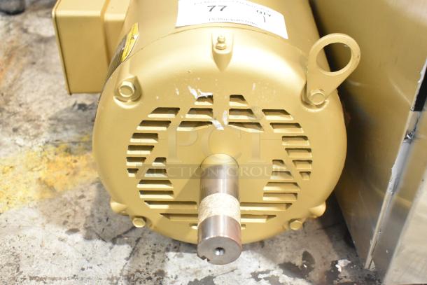 LIKE NEW Baldor SuperE Motor, 230/460V, 3 Phase. Gold finish with tag visible. Excellent condition.
