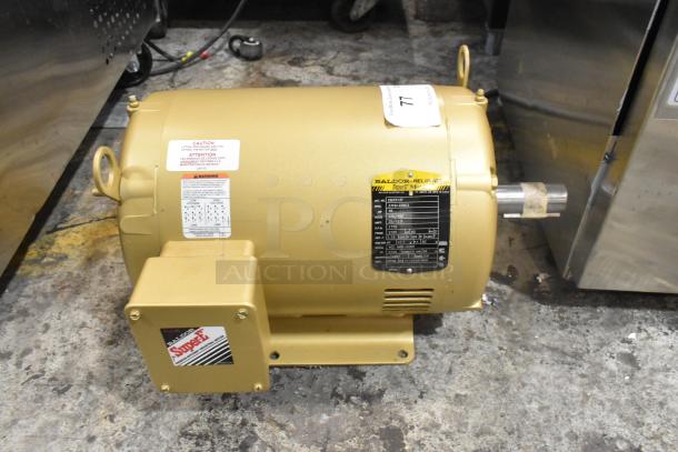LIKE NEW Baldor SuperE Motor, 230/460V, 3 Phase, gold finish, model info visible. Optimal for energy efficiency.