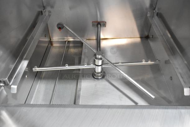 Brand new 2024 Noble Wareforce UH30-FND stainless steel undercounter dishwasher interior, showing spray arms and filters.