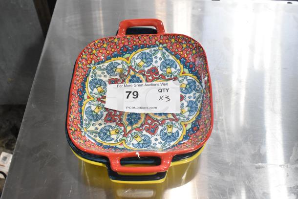 Three colorful patterned dishes with handles, featuring intricate designs. Includes auction label, marked "79 QTY x3".